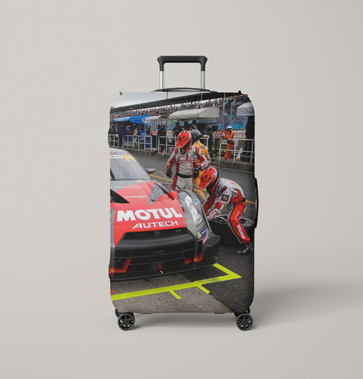changing the wheels of car racing motul Luggage Covers | Suitcase