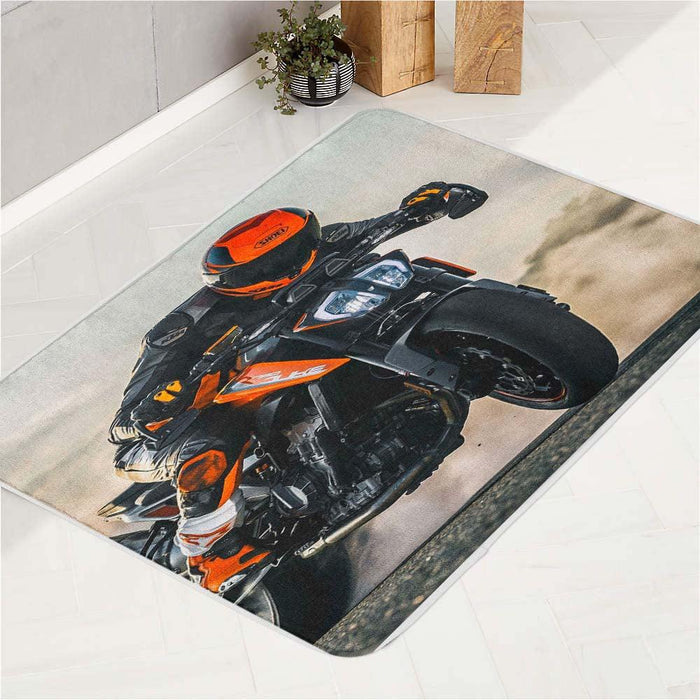 man riding  front of desert bath rugs