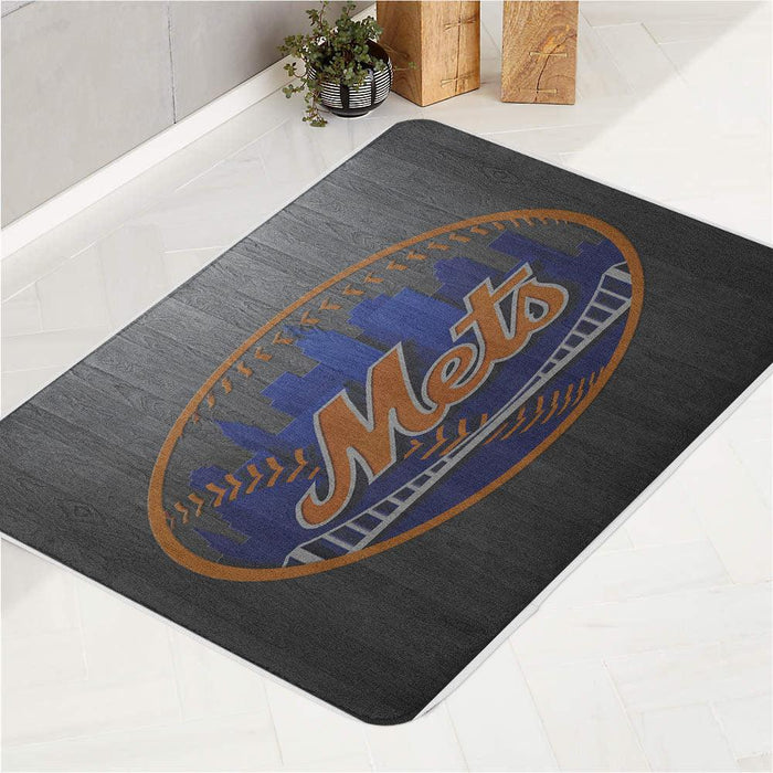 monochrome wood mets logo bath rugs