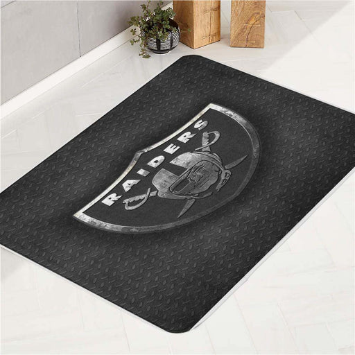 steel textrure of raider logo bath rugs