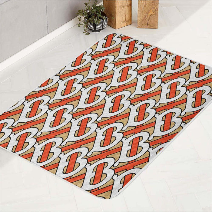 textured burberry font logo bath rugs