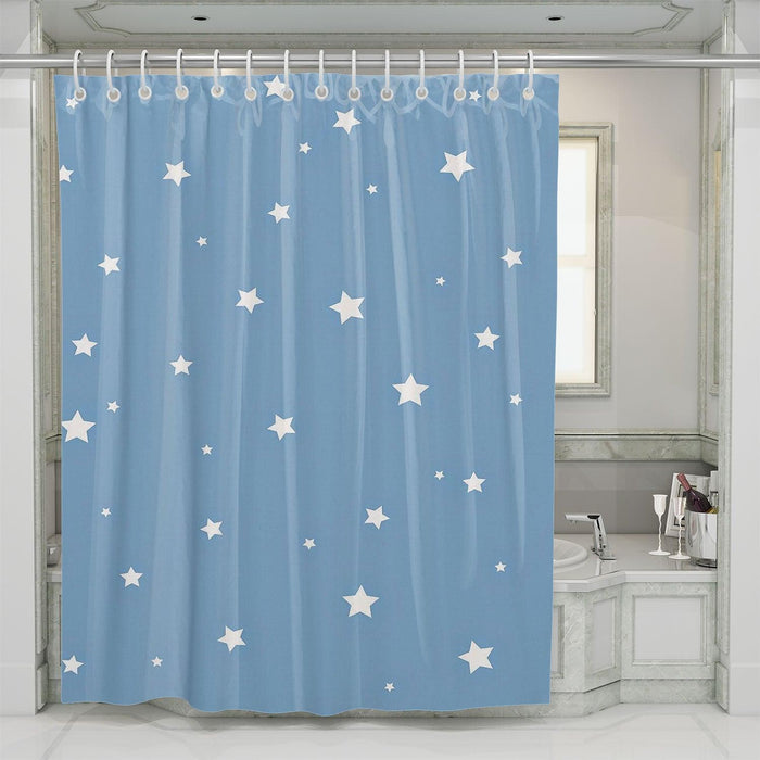 white stars in the center of blue shower curtains