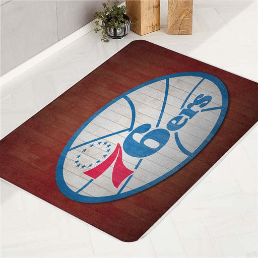 warm colour of 76ers logo bath rugs